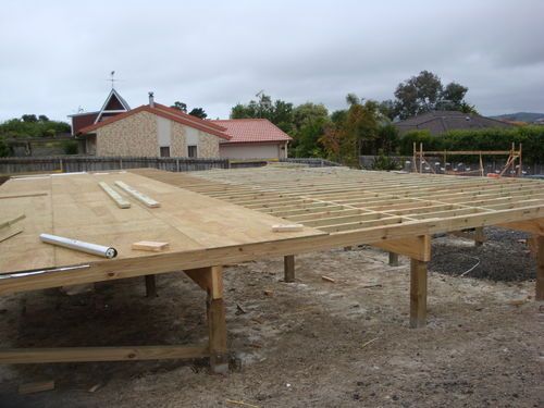 Glesan place, Beachlands. Piled, timber framed floor almost ready for wall framing.