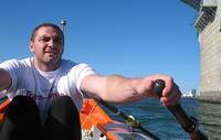Andrew McCowan rows under the Auckland Harbour bridge in training