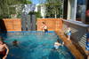 Keld built the deck and coping around the pool and installed the water feature and the shutters